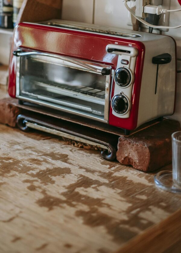 4 Slice Crisp N Bake Air Fry Toaster Oven toaster oven standing on old shabby table